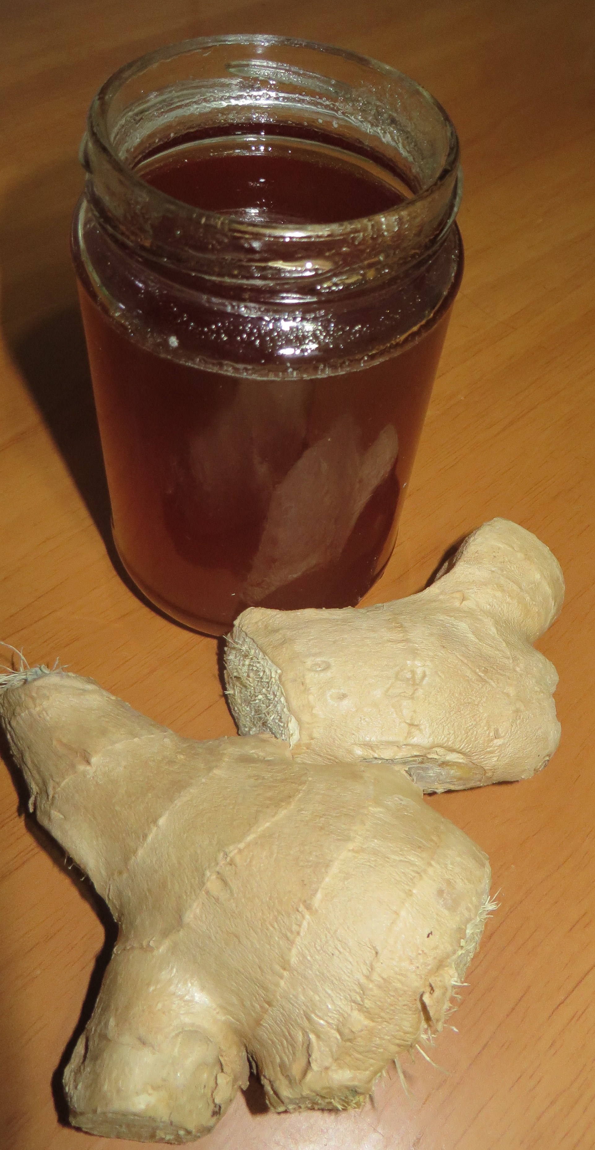 jar of honey and fresh ginger treat cancer