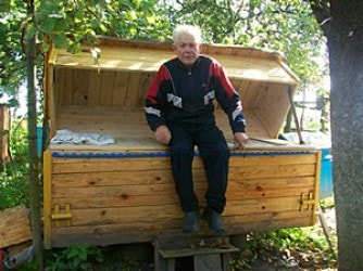 sleeping in a bed above the hives